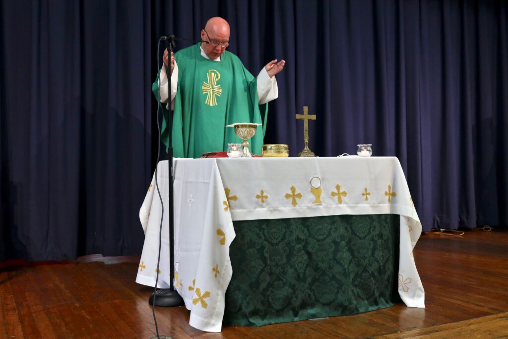 Fr. Antonin celebrating Mass in McLaughlin Hall on July 12, 2020