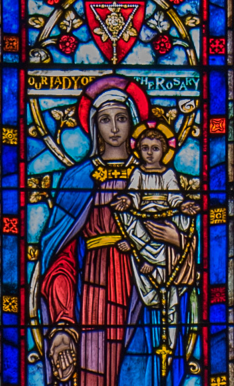 Stained glass window of Our Lady of the Rosary